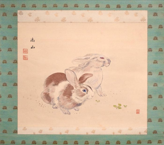 Two rabbits hanging for sale  
