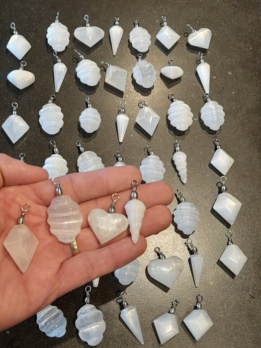 Cut selenite pendants for sale  
