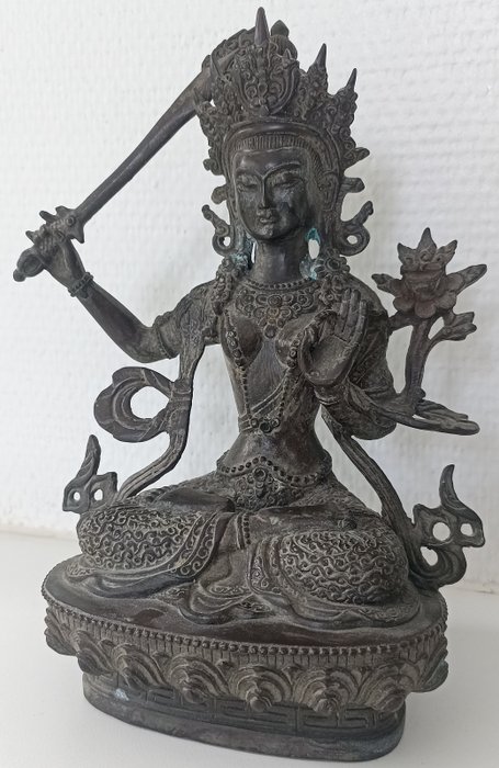 Buddhist deity bronze usato  