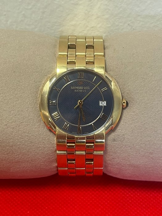Raymond weil gold d'occasion  