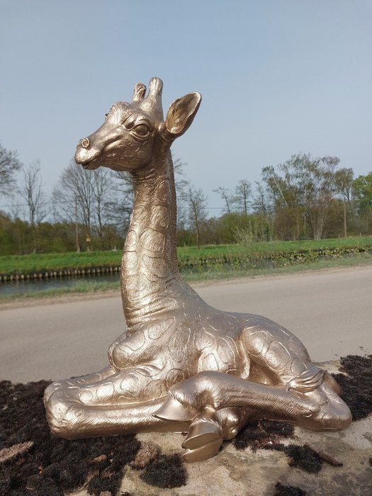 Statue lying golden for sale  