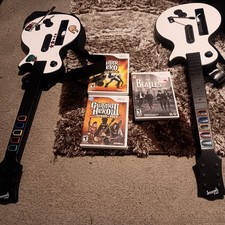 Pacote Guitar Hero Ninetendo Wii com duas guitarras e três jogos comprar usado  Enviando para Brazil