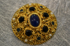 Belle broche dorée d'occasion  Ézanville