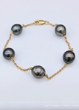Bracelet orné perles d'occasion  Les Mureaux