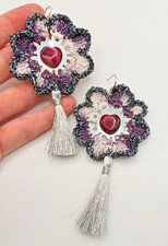 Orecchini fiore viola usato  Roma