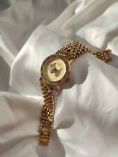 Montre vintage doré d'occasion  Le Grand-Lemps