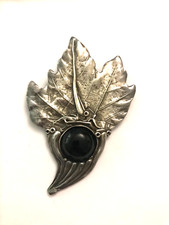 Broche métal signé d'occasion  Cernay