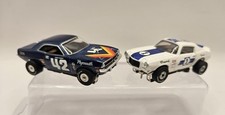 2 AUTO WORLD T-JET 500 H.O. Slot Cars 1970 CUDA #42 & 1970 CAMARO #1 (funciona) comprar usado  Enviando para Brazil