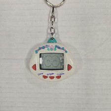 VINTAGE DINKIE DINO *RAKURAKU DINOKUN* Branco ANIMAL DE ESTIMAÇÃO VIRTUAL! Testado e funcionando  comprar usado  Enviando para Brazil