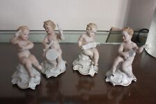 Statuette putti musici. usato  Milano