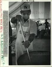 Usado, 1984 Press Photo Festival Andouille- Milton LaRousse mexendo feijão e arroz comprar usado  Enviando para Brazil