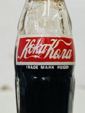 Bouteille miniature 8 cm double face “Koka-Kora / Coca-Cola” peinture émaillée na sprzedaż  Wysyłka do Poland