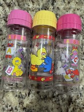 Conjunto de 3 mamadeiras vintage Playtex drop in.  Sesame Street 8 oz. Sem mamilo, usado comprar usado Conjunto de 3 mamadeiras vintage Playtex drop in.  Sesame Street 8 oz. Sem mamilo, usado comprar usado  Enviando para Brazil