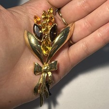 Broche fleur dorée d'occasion  Andernos-les-Bains