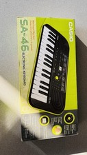 Mini teclado Casio SA-46 32 teclas, verde preto, 100 tons, 50 padrões comprar usado  Enviando para Brazil