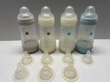 Quatro mamadeiras infantis anticólicas MAM de 9 oz com 11 tamanhos e tampas variados de mamilo comprar usado Quatro mamadeiras infantis anticólicas MAM de 9 oz com 11 tamanhos e tampas variados de mamilo comprar usado  Enviando para Brazil
