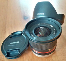 Lente de câmera Samyang 12mm f/2 NCS CS foco manual ultra amplo para MFT + capô, bonés comprar usado  Enviando para Brazil