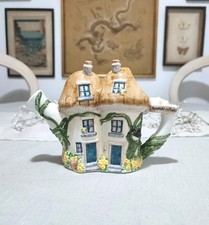 Village collectables watering for sale  CROYDON