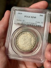 Busto com tampa de prata 1819 meio dólar PCGS XF45 - Álbum aro arco-íris tonificado geração 4.3 comprar usado Busto com tampa de prata 1819 meio dólar PCGS XF45 - Álbum aro arco-íris tonificado geração 4.3 comprar usado  Enviando para Brazil