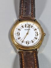 Antigo relógio Guess 1992 mostrador branco redondo tom dourado estojo pulseira de couro marrom comprar usado  Enviando para Brazil