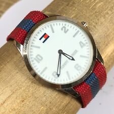 Reloj de cuarzo Tommy Hilfiger unisex F90027 esfera blanca rojo azul correa OTAN 7 1/2" segunda mano  Embacar hacia Argentina