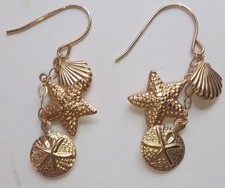BRINCOS PENDENTES NÁUTICOS VINTAGE OURO 14K VIEIRA CONCHA ESTRELA DO MAR DÓLAR AREIA 1,5" comprar usado  Enviando para Brazil