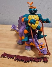 Teenage Mutant Ninja Turtles Cave-Turtle Mike and His Silly Stegosaurus 4" comprar usado  Enviando para Brazil