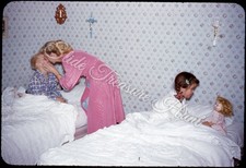 Woman tucking kids for sale  Prairie Village