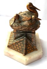 RÉGULE TIRELIRE NID DE CIGOGNES SUR UN TOIT MONEY BOX STORK NEST ON A ROOF comprar usado  Enviando para Brazil