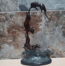 Three bronze otters for sale  Humble