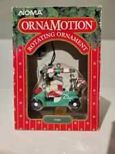 Noma OrnaMotion 'FORE!' Ornamento giratório de carrinho de golfe Papai Noel 1989 - #2372 perfeito estado comprar usado  Enviando para Brazil