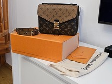 Louis vuitton pochette d'occasion  Expédié en Belgium