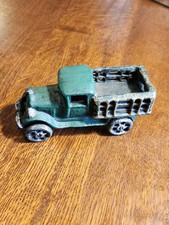 Caminhão de brinquedo vintage de ferro fundido com cama de estaca comprar usado  Enviando para Brazil