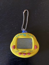 RakuRaku DinoKun AMARELO Dinkie Dino Electronic Virtual Pet TK-910 | Testado, usado comprar usado  Enviando para Brazil
