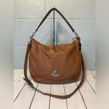 Coach tan pebbled for sale  Yaphank
