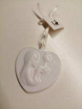Cuore con bambina usato  Noci