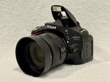 Lente Nikon D5100 16.2 MP DSLR - Preta com AF-S 35mm f/1.8G Prime 10.645 atuações comprar usado  Enviando para Brazil