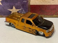 MAISTO 2004 FORD F150, OURO COM CHAMAS PRETAS, PNEUS DE BORRACHA FIRESTONE 1:64 comprar usado  Enviando para Brazil