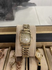 Relógio de pulso masculino Elgin década de 1950, cor dourada, cristal transparente, design art déco comprar usado Relógio de pulso masculino Elgin década de 1950, cor dourada, cristal transparente, design art déco comprar usado  Enviando para Brazil