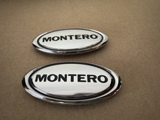 Usado, FRETE GRÁTIS FABRICANTE DE EQUIPAMENTO ORIGINAL 01-06 MITSUBISHI MONTERO CONJUNTO DE EMBLEMA PARA-LAMA DIANTEIRO comprar usado  Enviando para Brazil