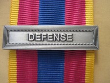 Agrafe defense médaille d'occasion  Conches-en-Ouche