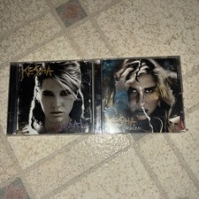 Ke$ha “Animal” & “Cannibal” *BUNDLE OF 2 CDS* (2010) comprar usado Ke$ha “Animal” & “Cannibal” *BUNDLE OF 2 CDS* (2010) comprar usado  Enviando para Brazil
