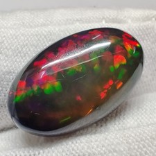 Opala preta natural 9,6 ct Welo vermelho vivo verde fogo cabine oval colecionadores pedra preciosa comprar usado  Enviando para Brazil