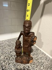 African woman carrying for sale  Katy