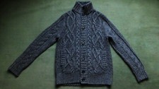 Pull gris torsadé d'occasion  Paris XVII