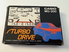 Vintage Casio LCD Calculadora Juego Turbo Drive MG-200 (1983). Instrucciones en caja segunda mano  Embacar hacia Mexico