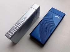 Encendedor metálico Marlboro. Juego de dos encendedores, azul y plata. No usado segunda mano  Embacar hacia Mexico