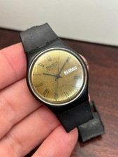 Vintage 1983 Relógio Swatch Fabricado na Suíça Mostrador Dourado Data do Dia 34mm - Para Reparo comprar usado Vintage 1983 Relógio Swatch Fabricado na Suíça Mostrador Dourado Data do Dia 34mm - Para Reparo comprar usado  Enviando para Brazil