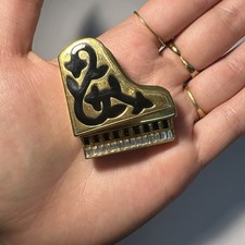 Broche piano dorée d'occasion  Andernos-les-Bains