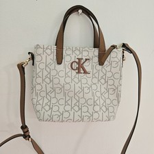Usado, Bolsa tiracolo Calvin Klein feminina CK logotipo estampa allover off white marrom LIMPA comprar usado  Enviando para Brazil